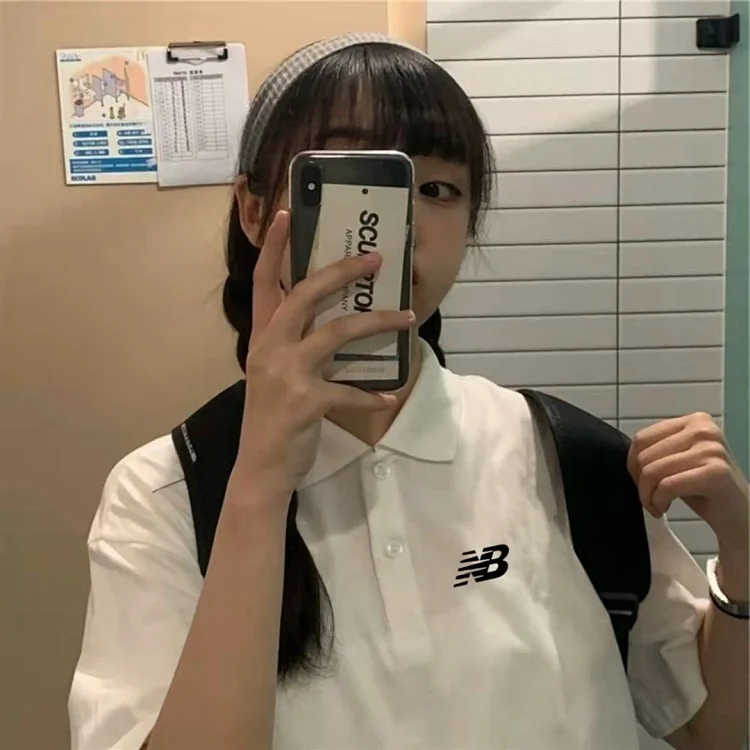 New Balance white short - sleeved polo shirt with NB logo