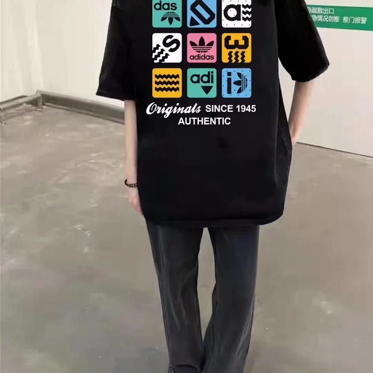 Colorful oversized black Adidas T-shirt with 'Originals SINCE 1945 AUTHENTIC' logos