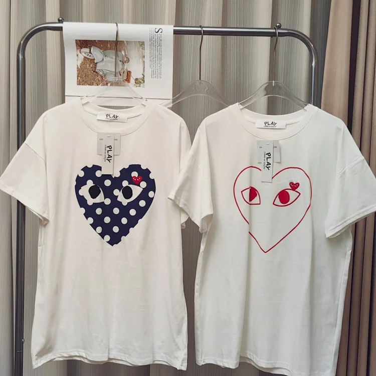 White T-shirt with blue polka dot heart and eyes print by PLAY